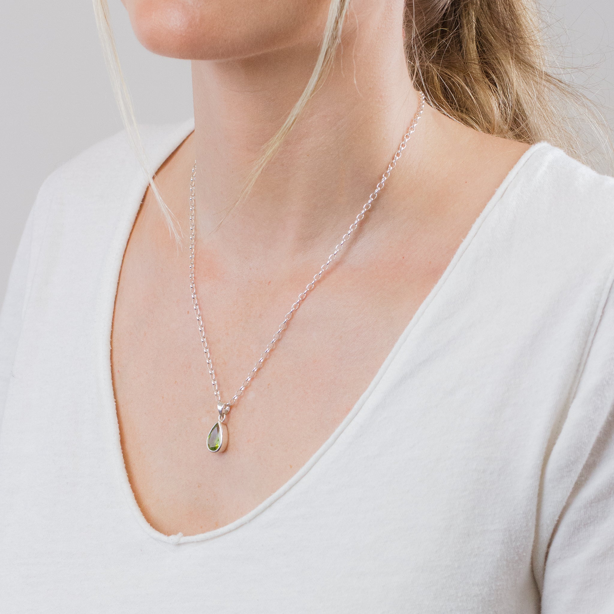 FACETED PERIDOT TEAR NECKLACE ON MODEL