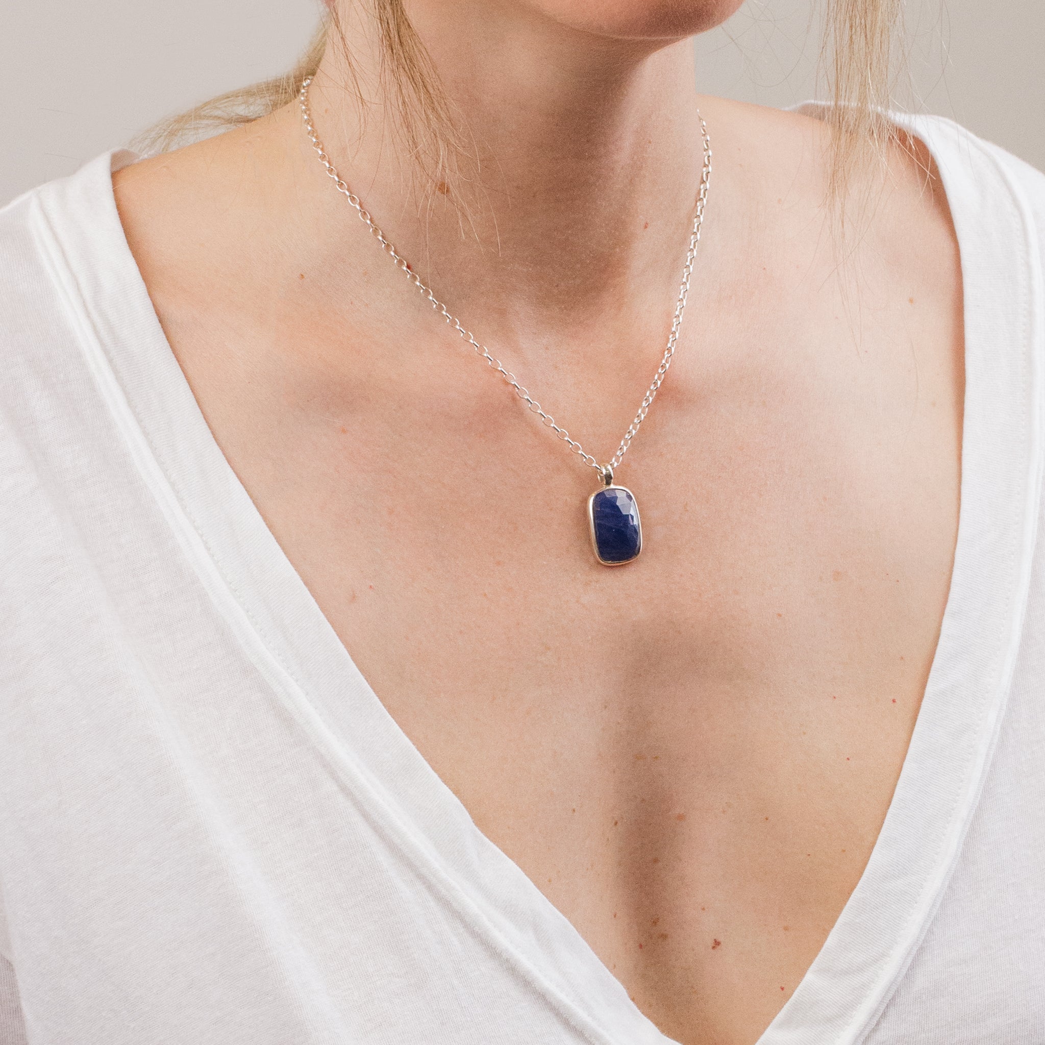 FACETED RECTANGULAR SAPPHIRE NECKLACE ON MODEL