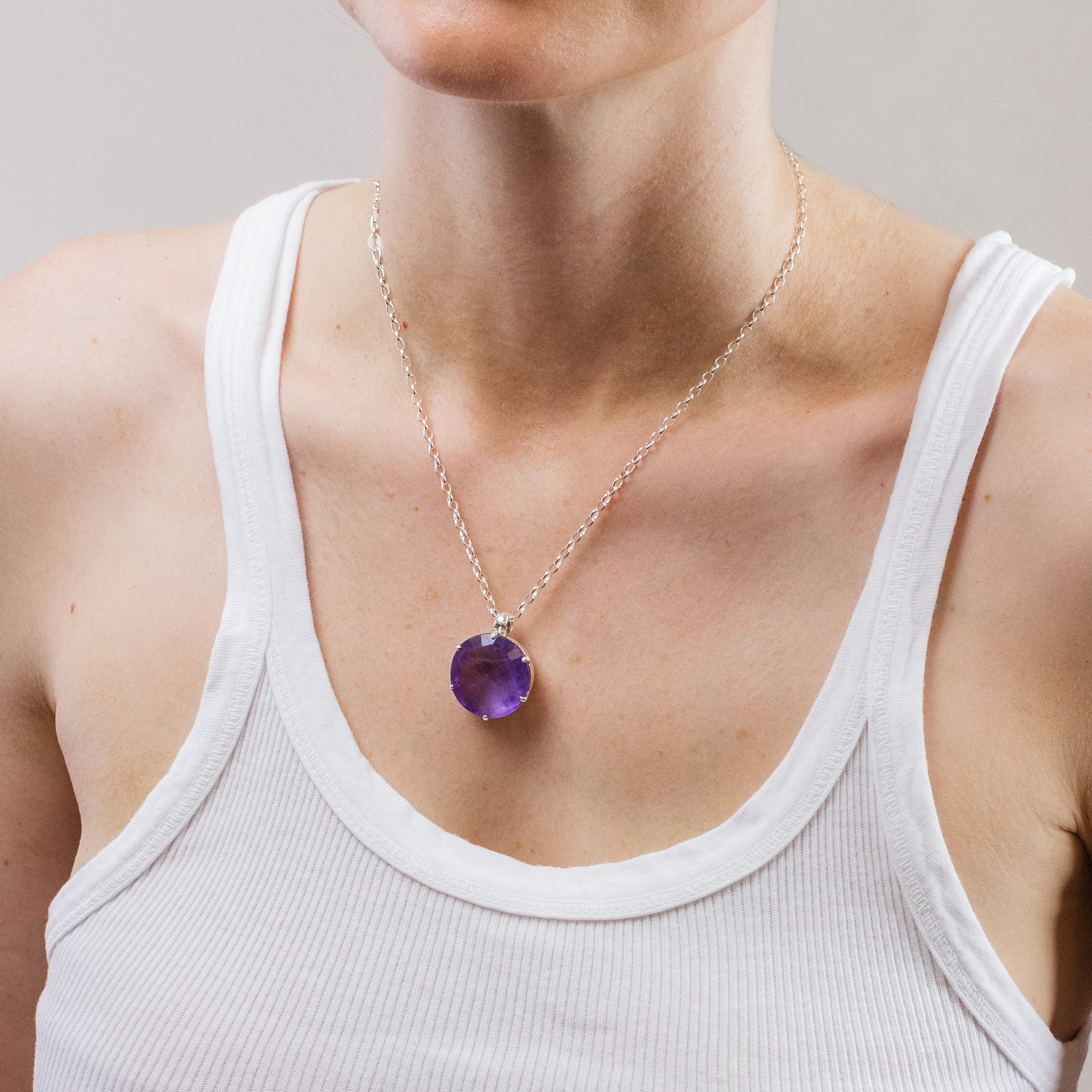 FACETED ROUND AMETHYST NECKLACE ON MODEL
