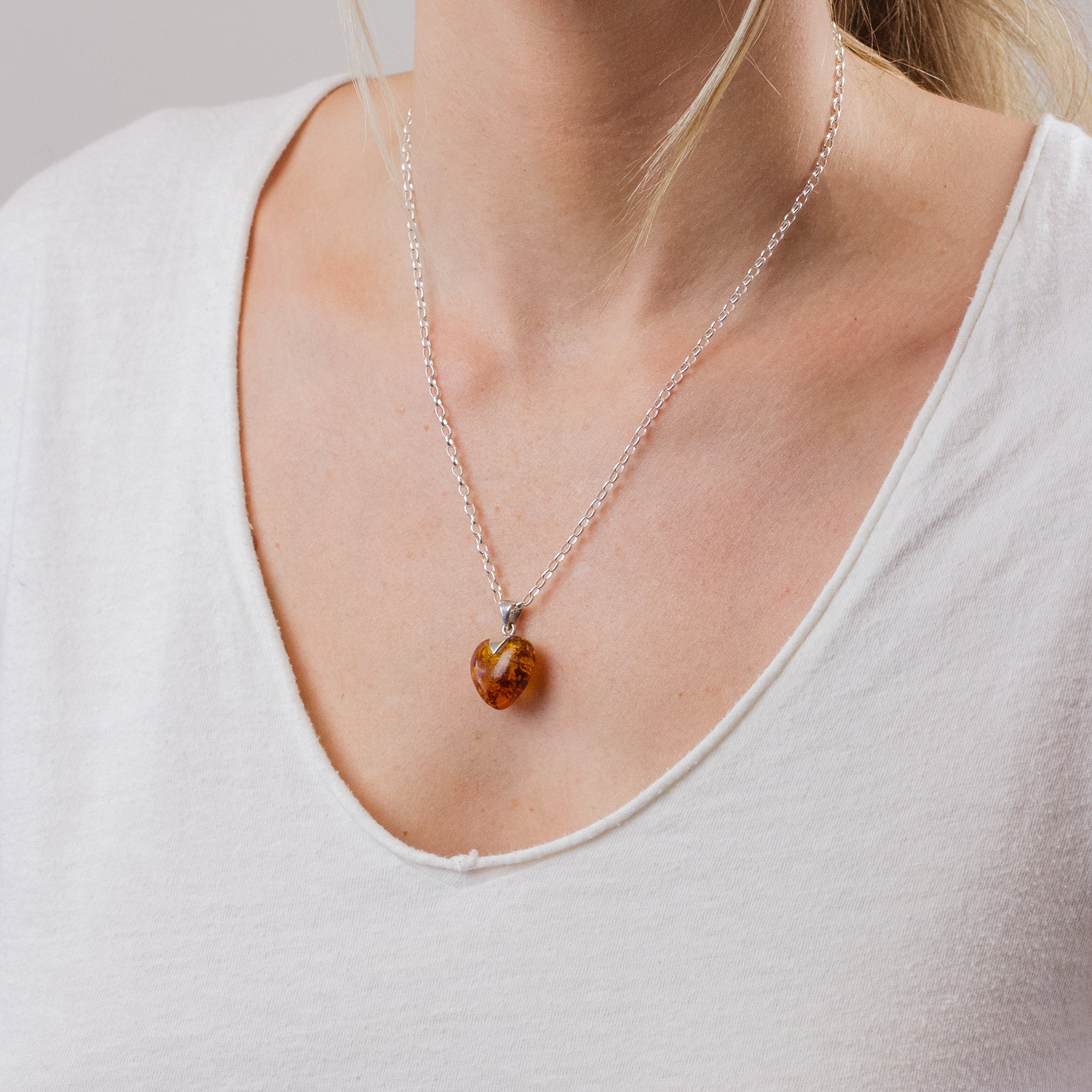 CABOCHON HEART AMBER NECKLACE ON MODEL