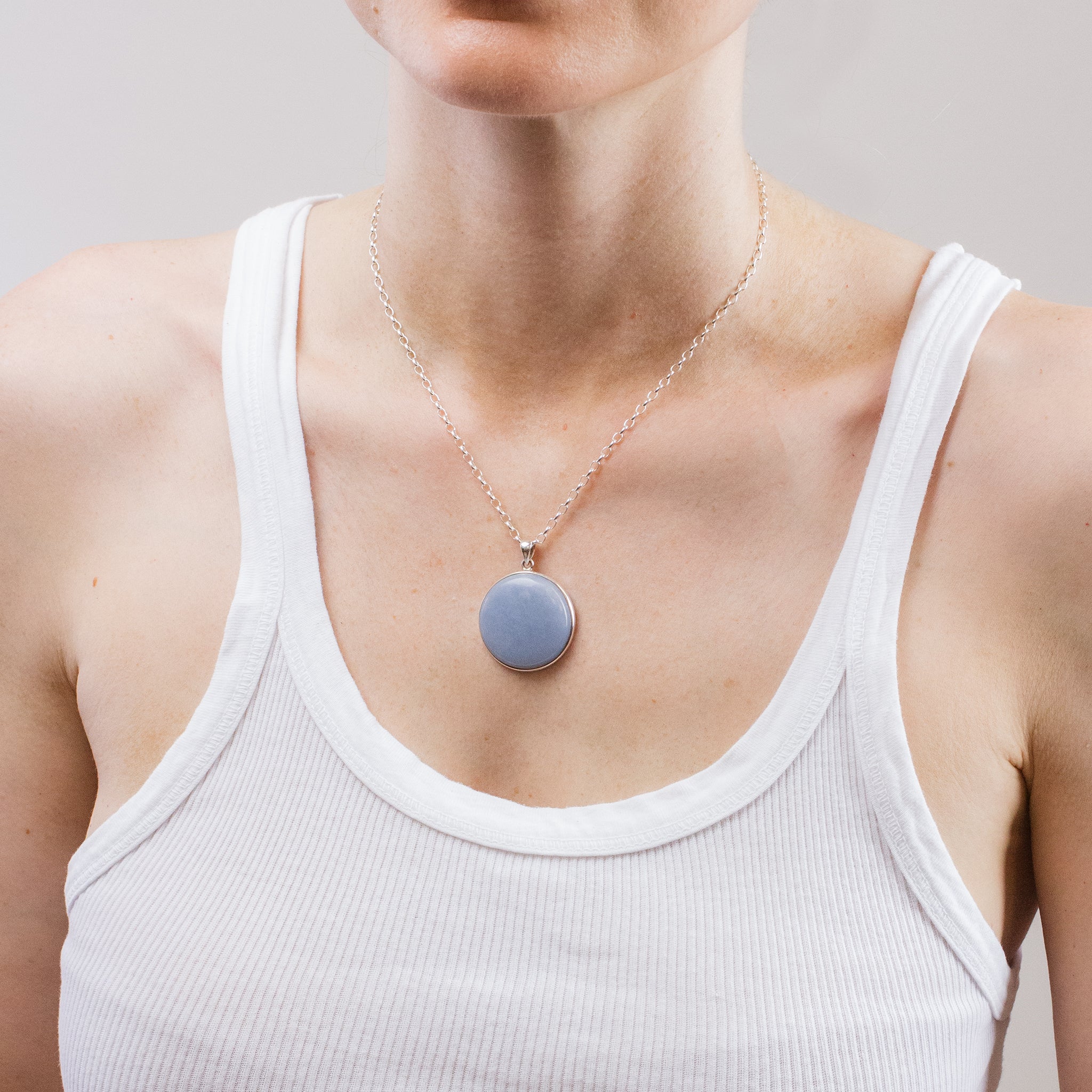 CABOCHON ANGELITE NECKLACE ON MODEL
