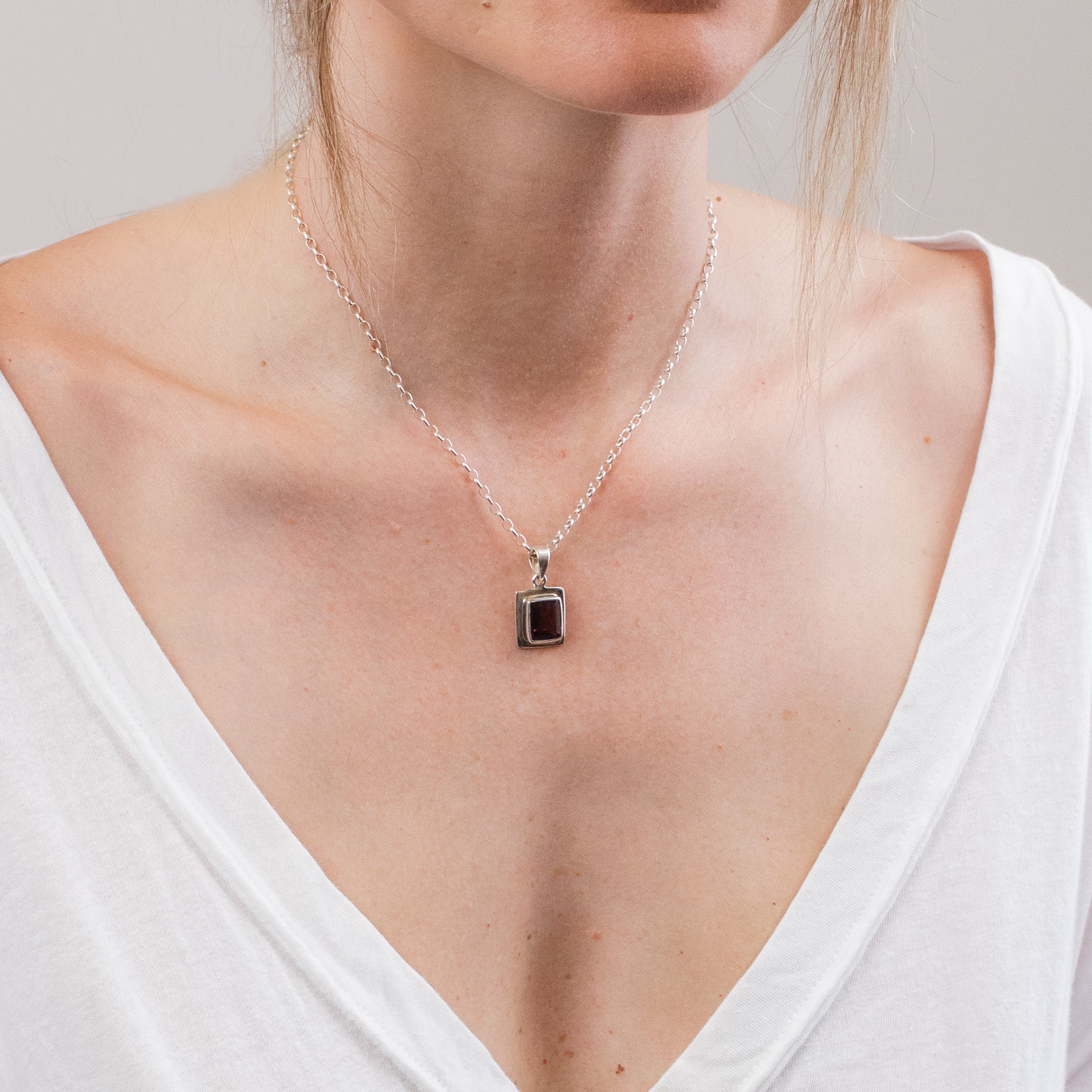 FACETED RECTANGULAR PINK TOURMALINE NECKLACE ON MODEL