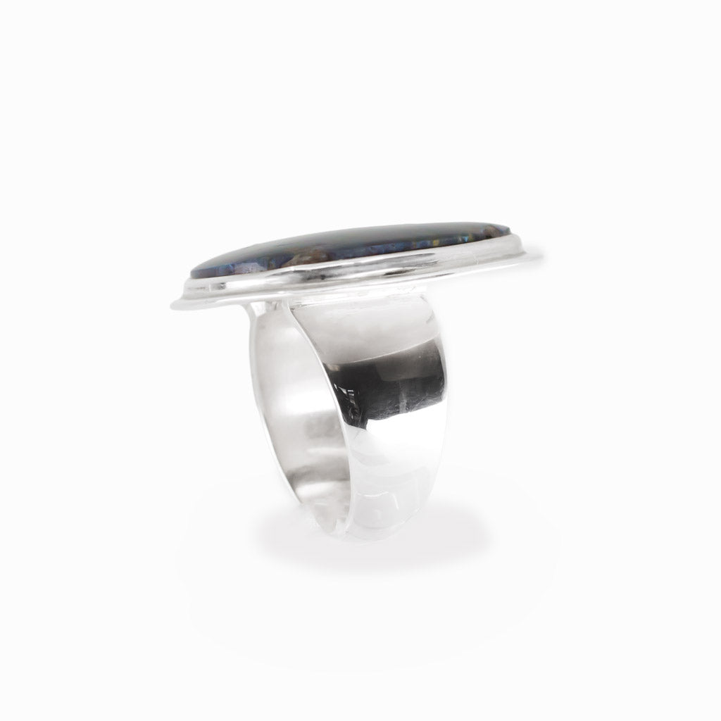Pietersite triangular cabochon ring in polished sterling silver with swirling navy blue, electric blue and golden-brown natural patterns.