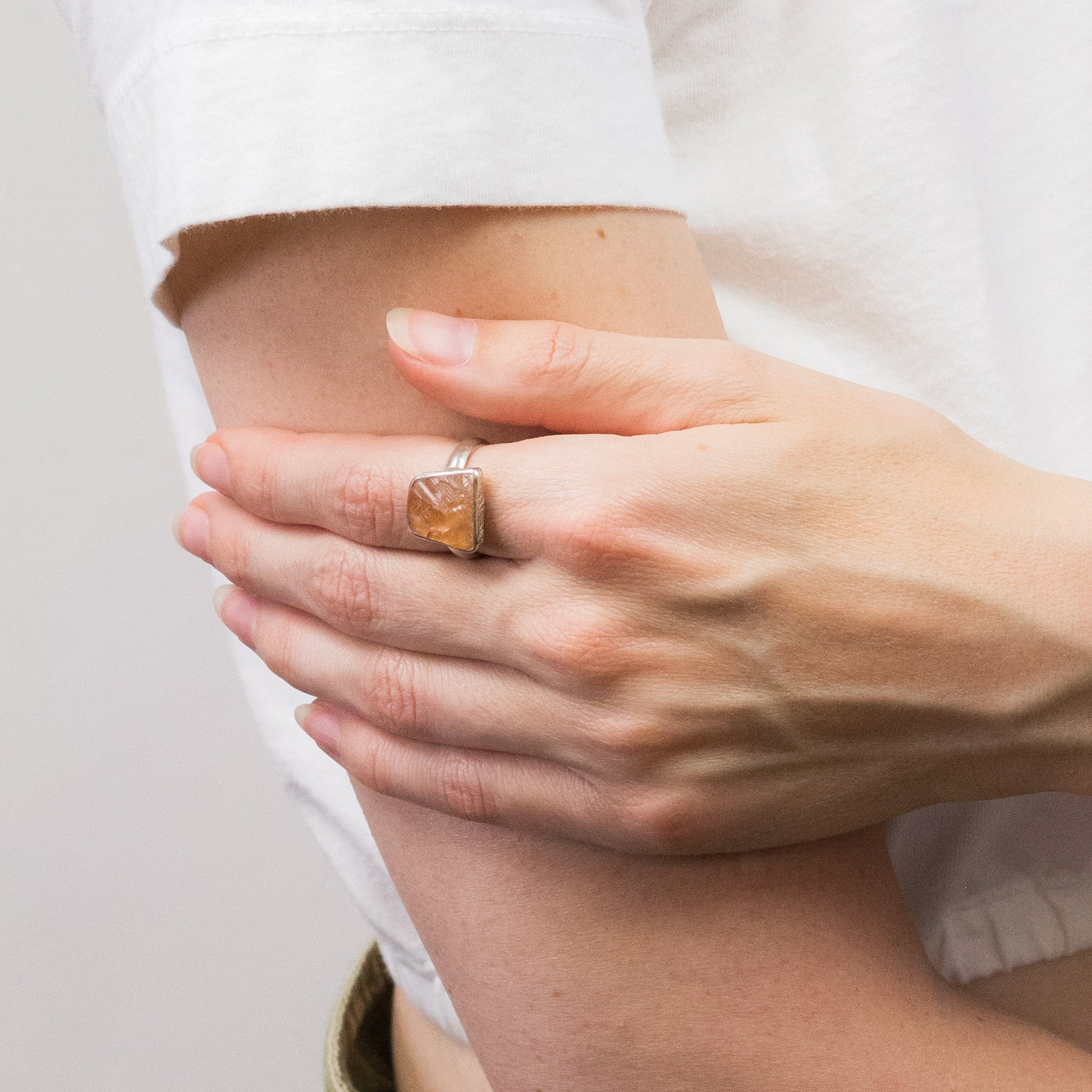 GROSSULAR RAW ORANGE GARNET RING ON MODEL