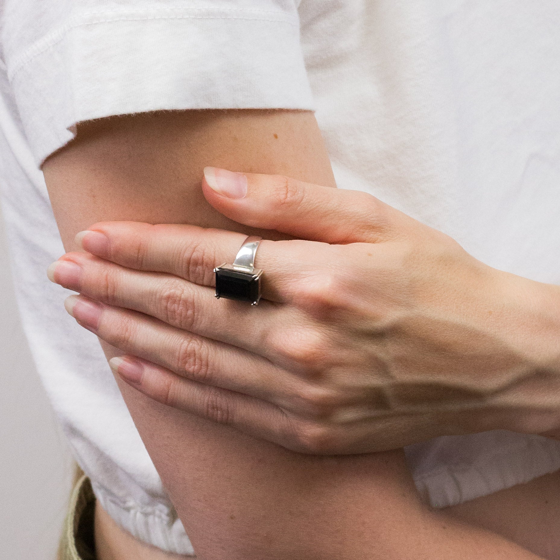 HEMATITE FACETED RECTANGULAR RING ON MODEL