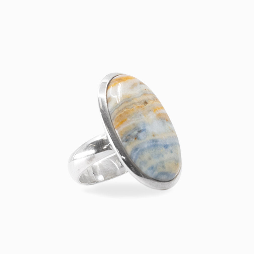 Oval Scheelite cabochon with natural cream, blue and golden banding set in 925 sterling silver.