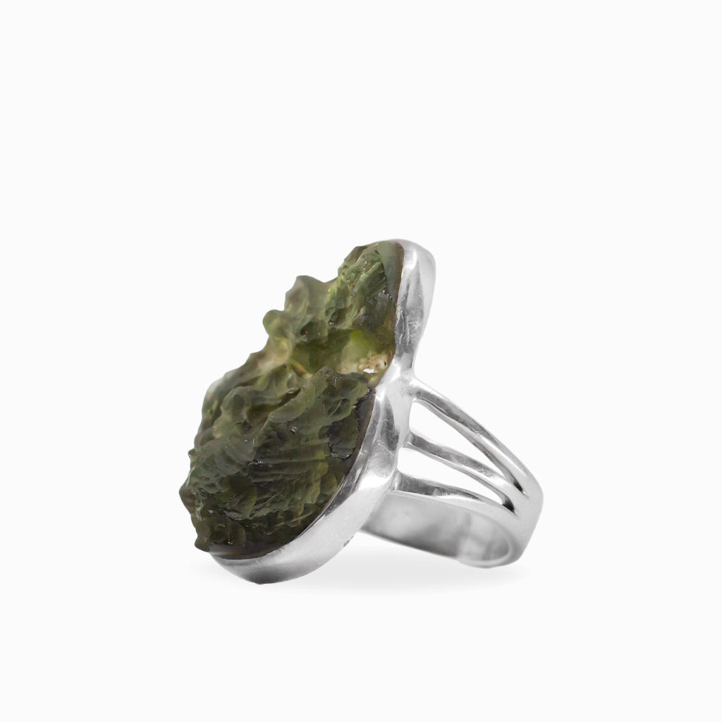 Raw freeform olive-green Moldavite ring with natural textured surface set in polished 925 sterling silver.