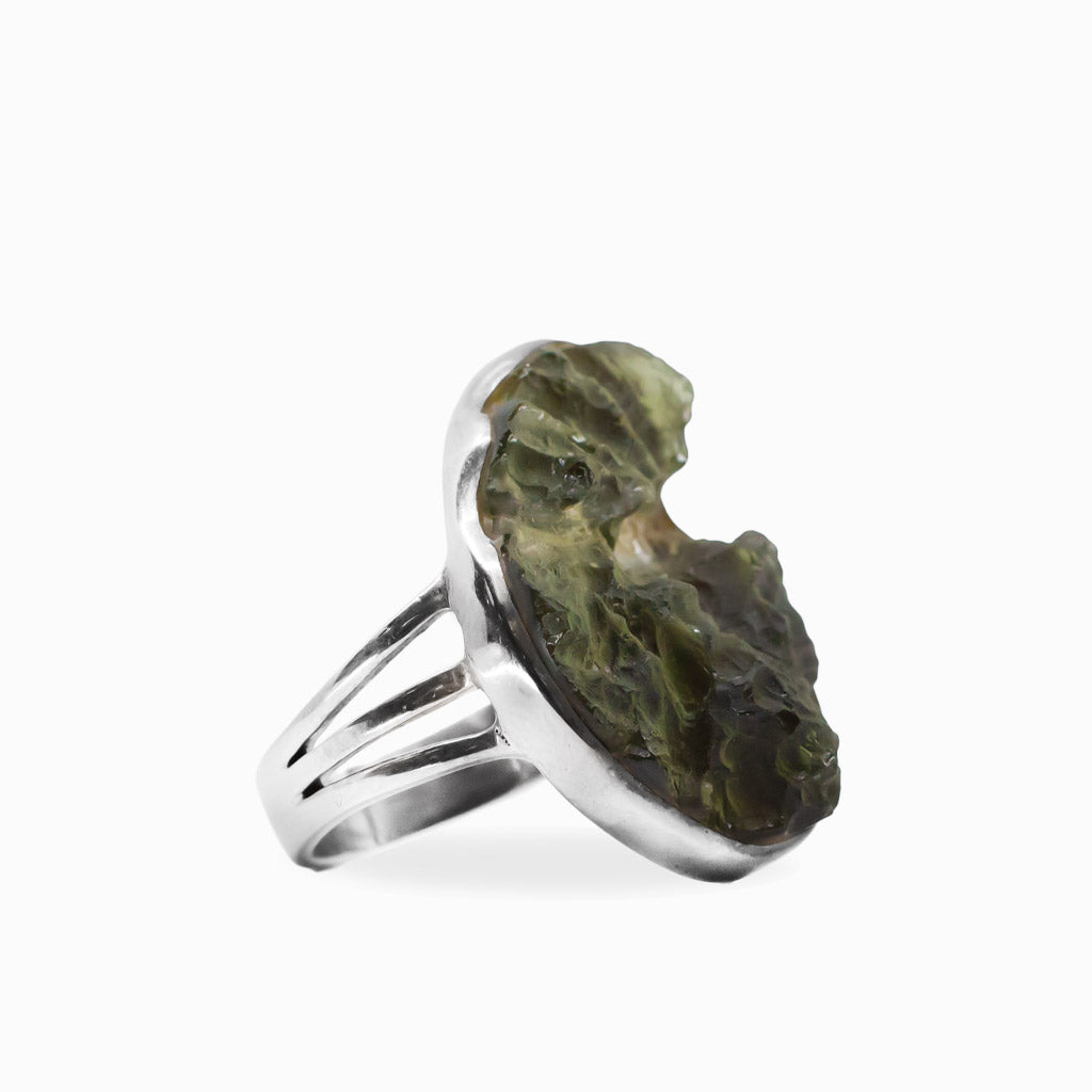Raw freeform olive-green Moldavite ring with natural textured surface set in polished 925 sterling silver.