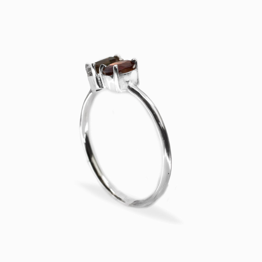 Faceted Garnet and pear-shaped Smoky Quartz two-stone ring in polished 925 sterling silver with a delicate silver band.