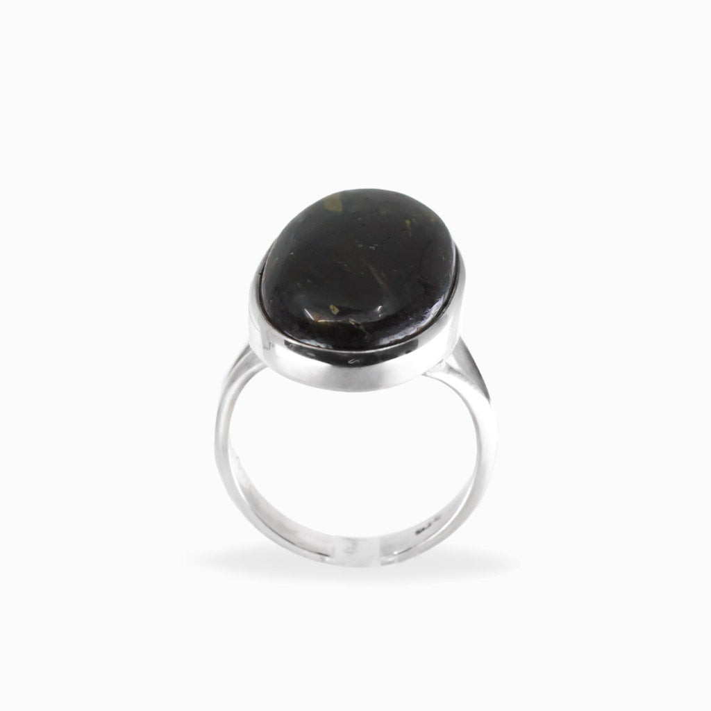 Elongated oval Nuummite cabochon ring with dark tones and subtle golden flashes in polished 925 sterling silver.