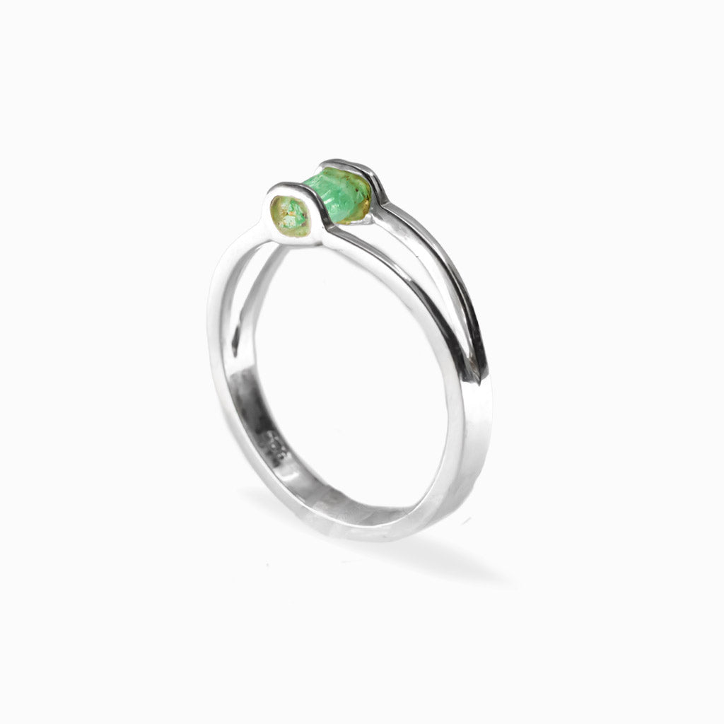 Raw rectangular green Emerald ring in polished 925 sterling silver with an open horizontal silver setting.
