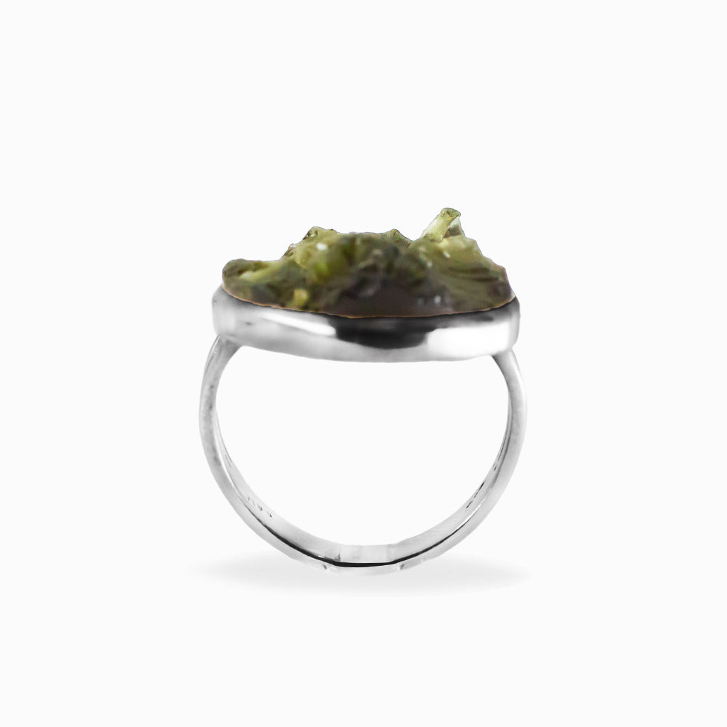 Raw freeform olive-green Moldavite ring with natural textured surface set in polished 925 sterling silver.