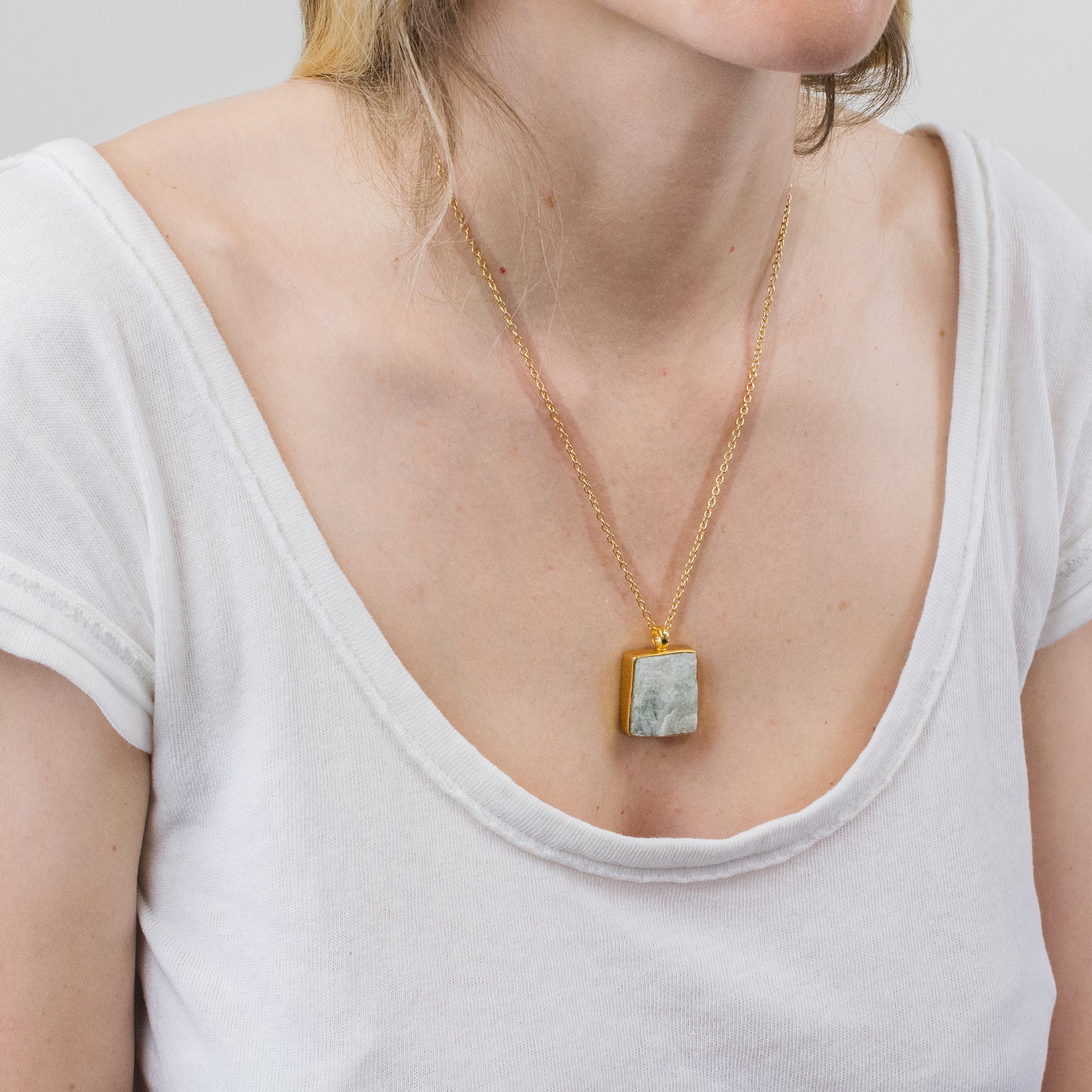 RAW AQUAMARINE NECKLACE WITH GOLD VERMEIL FINISH ON MODEL 