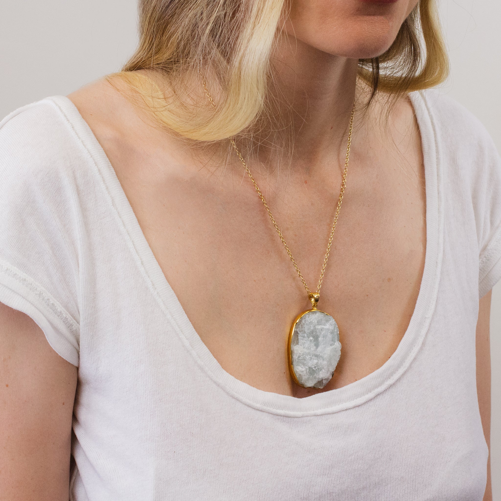 Raw Aquamarine Necklace with gold vermeil finish on model