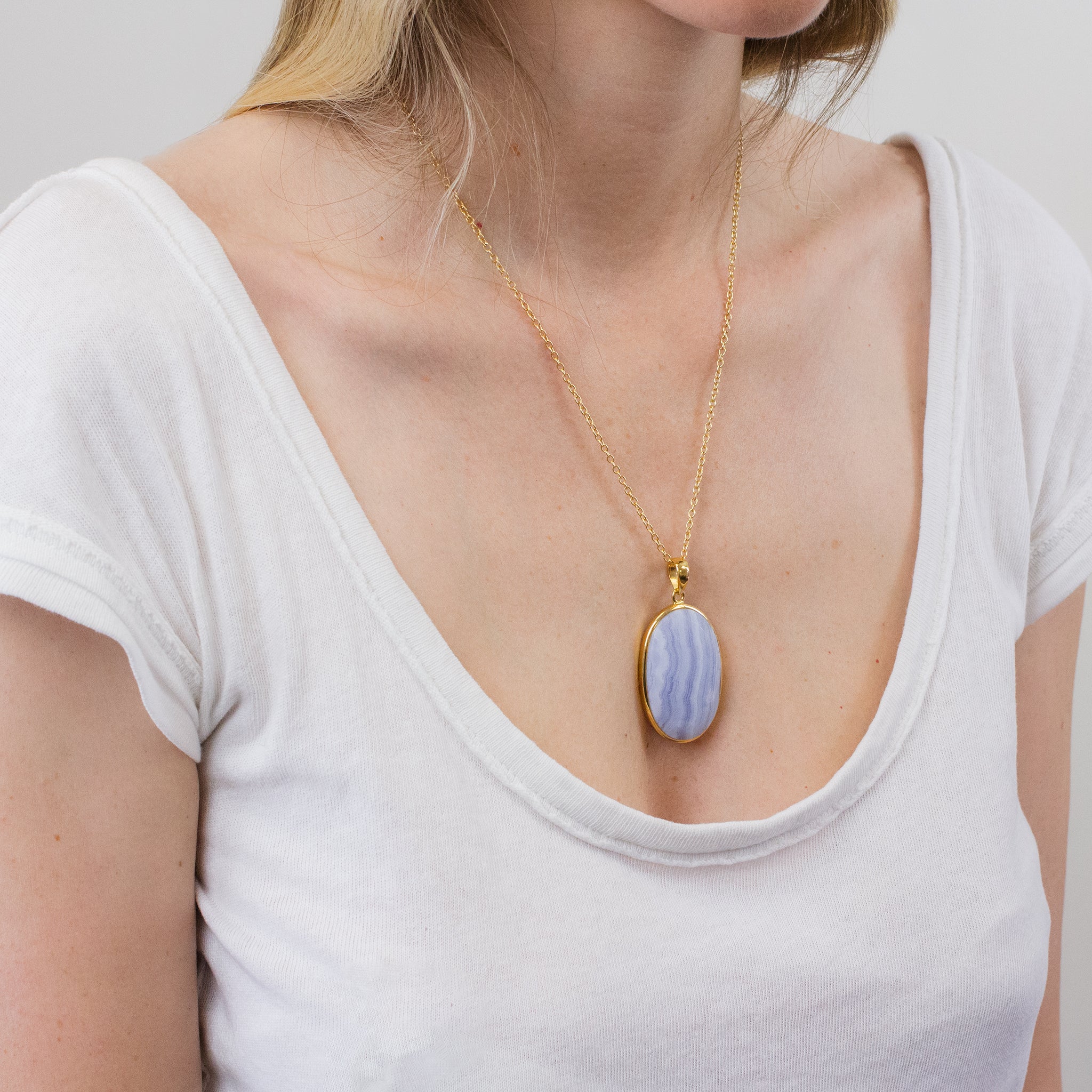 FACETED BLUE LACE AGATE NECKLACE WITH GOLD VERMEIL FINISH ON MODEL