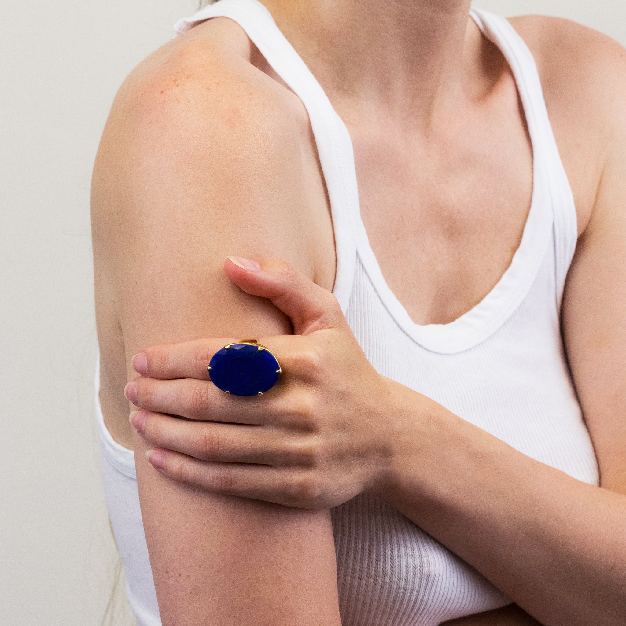 LAPIS LAZULI FACETED RING WITH GOLD VERMEIL FINISH ON MODEL