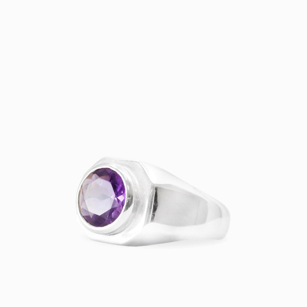 Round faceted purple Amethyst gemstone bezel set in a polished 925 sterling silver ring.