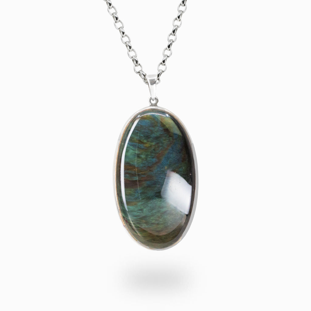 Oval Mancha de Huichol Obsidian pendant necklace in sterling silver with iridescent green and blue flashes.