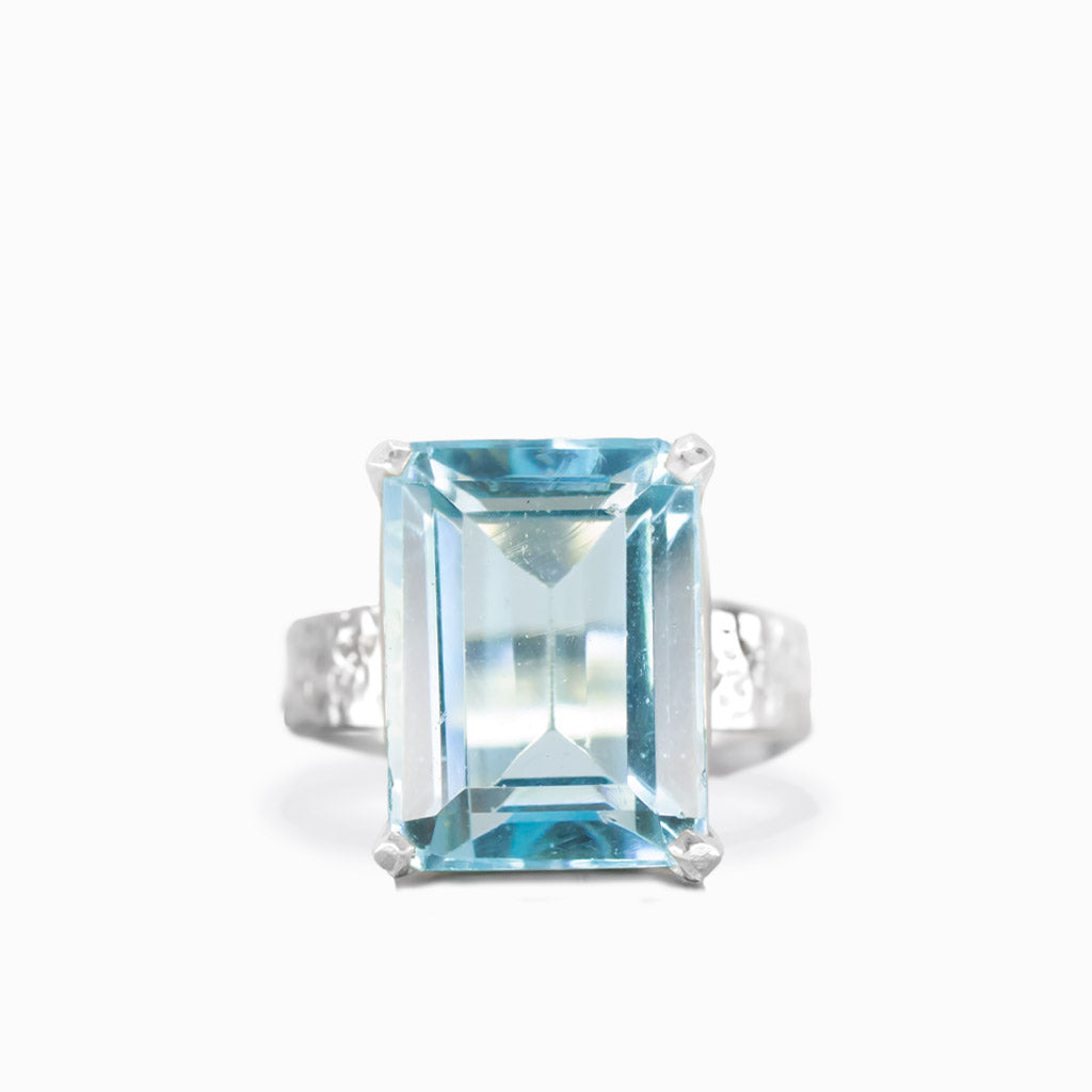 Faceted rectangular blue topaz ring in sterling silver