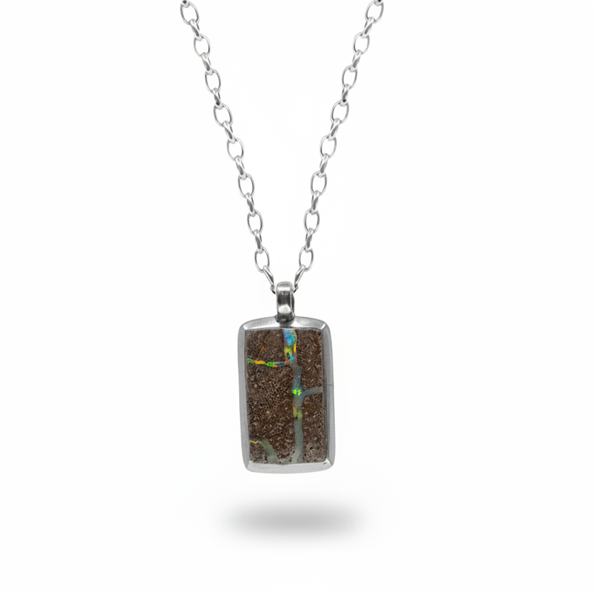 Rectangular boulder opal pendant with colorful veins set in sterling silver necklace