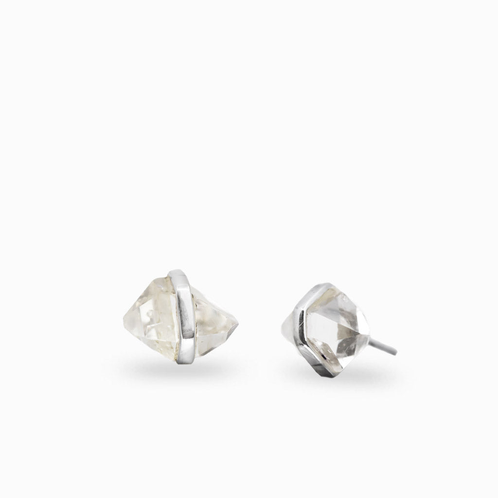 Sterling silver stud earrings featuring natural Herkimer Diamond quartz crystals.