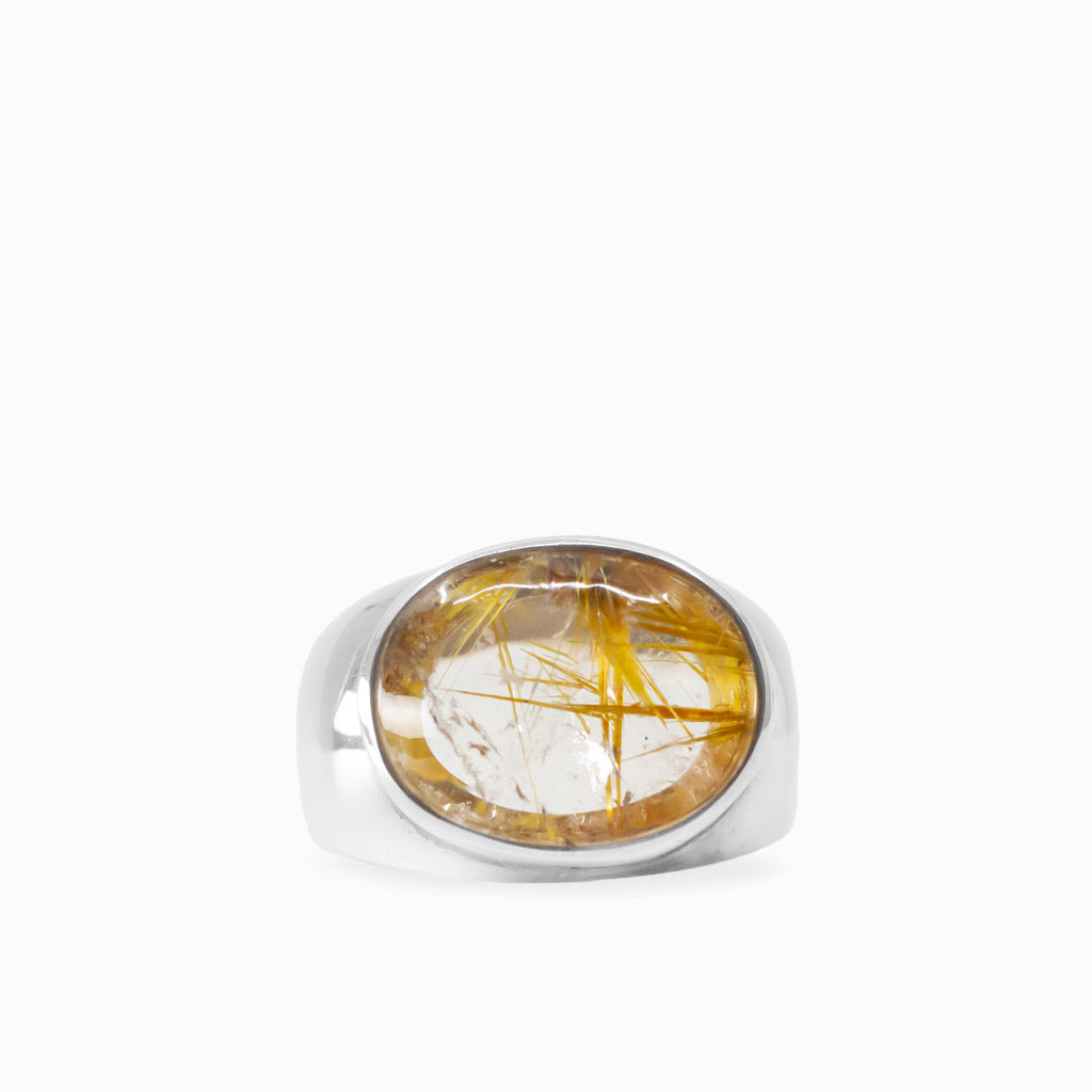 Oval Golden Rutilated Quartz cabochon with prominent golden needles bezel set in 925 sterling silver.