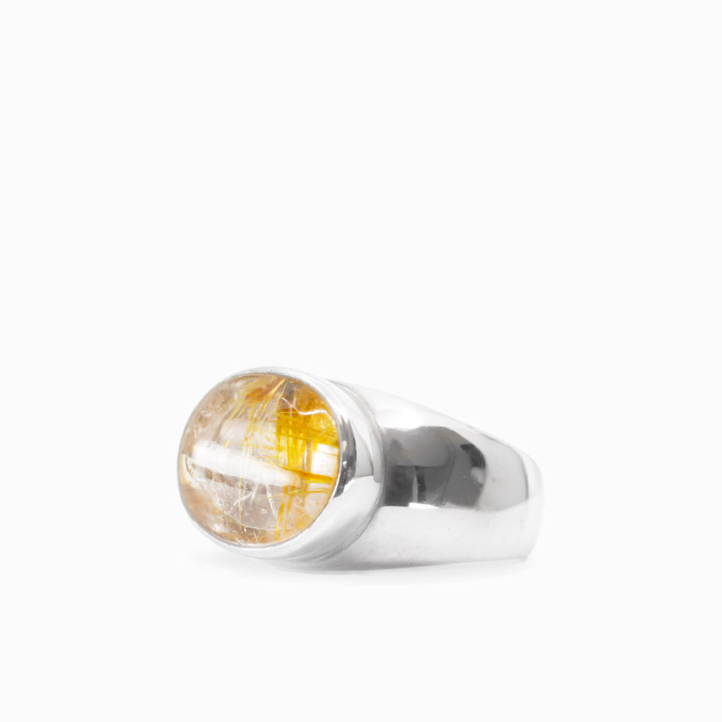 Oval Golden Rutilated Quartz cabochon with prominent golden needles bezel set in 925 sterling silver.
