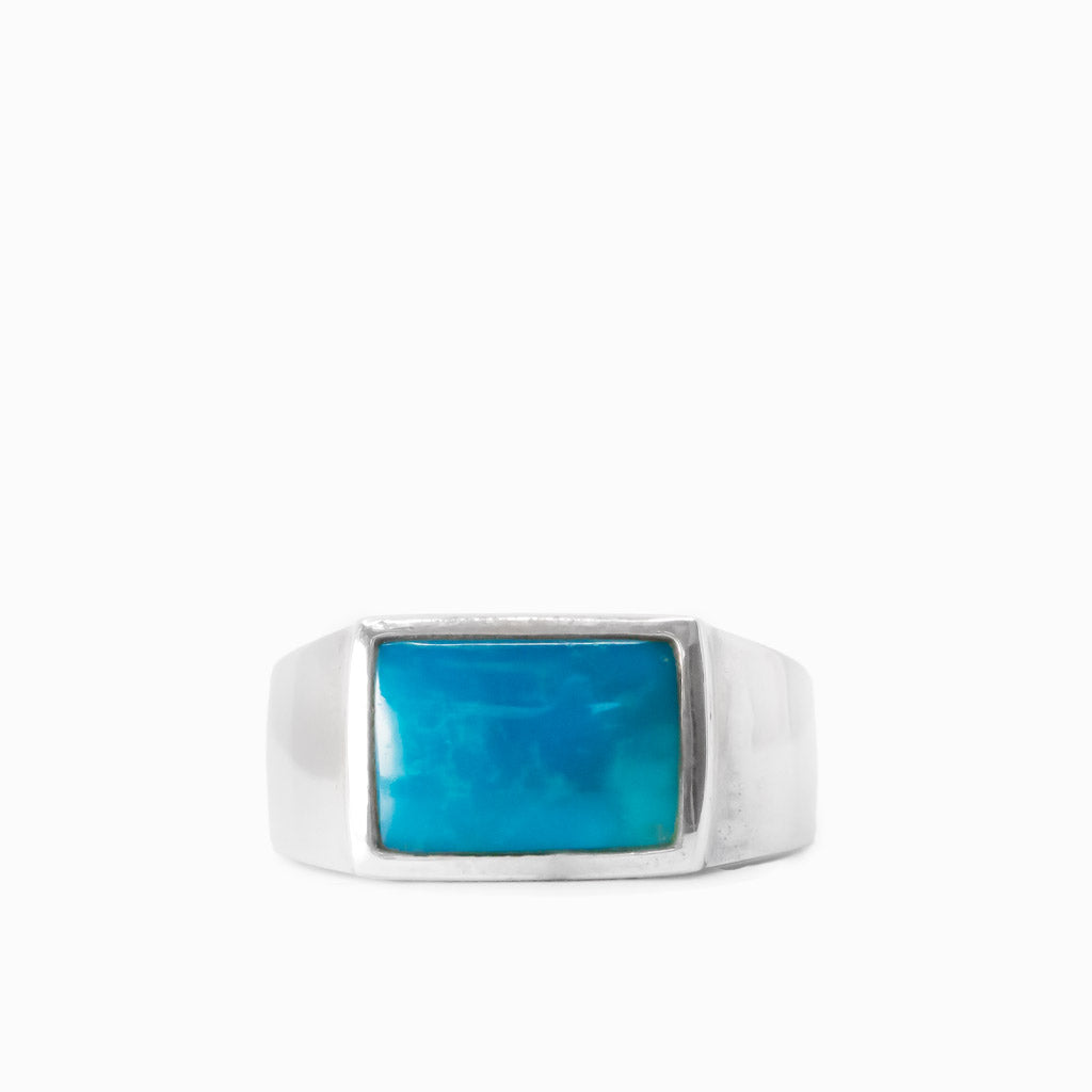 Rectangular vivid blue Sleeping Beauty Turquoise cabochon set in a polished 925 sterling silver ring.