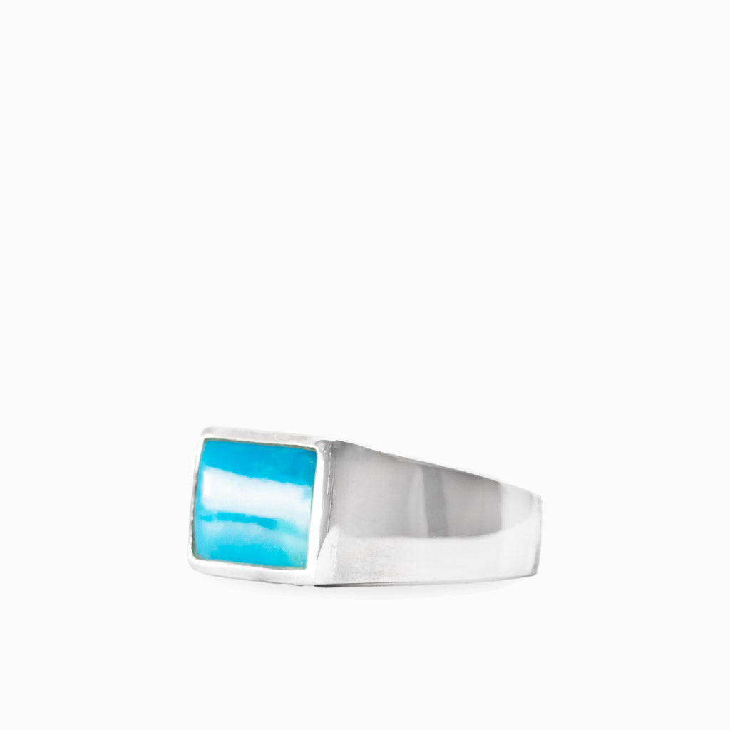 Rectangular vivid blue Sleeping Beauty Turquoise cabochon set in a polished 925 sterling silver ring.