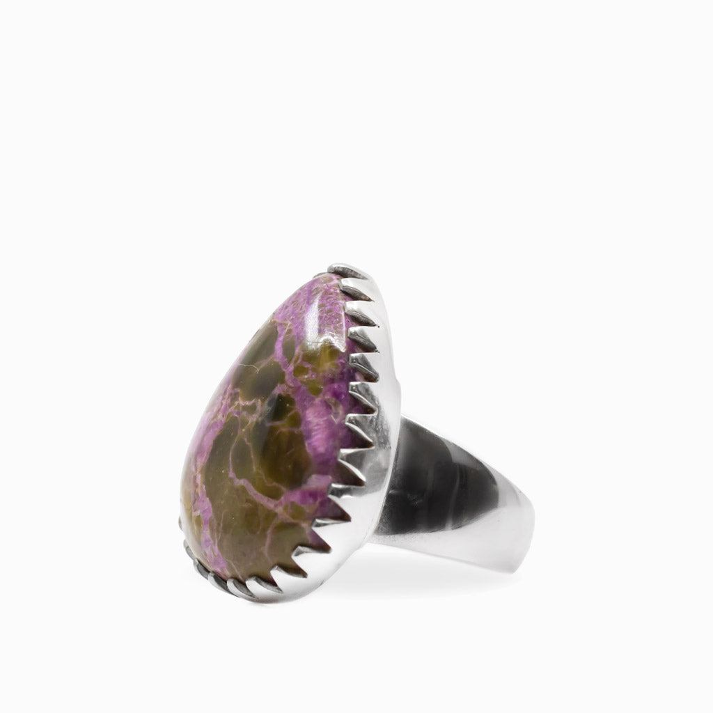 Purple and earthy brown Purpurite teardrop cabochon ring with decorative scalloped sterling silver setting.