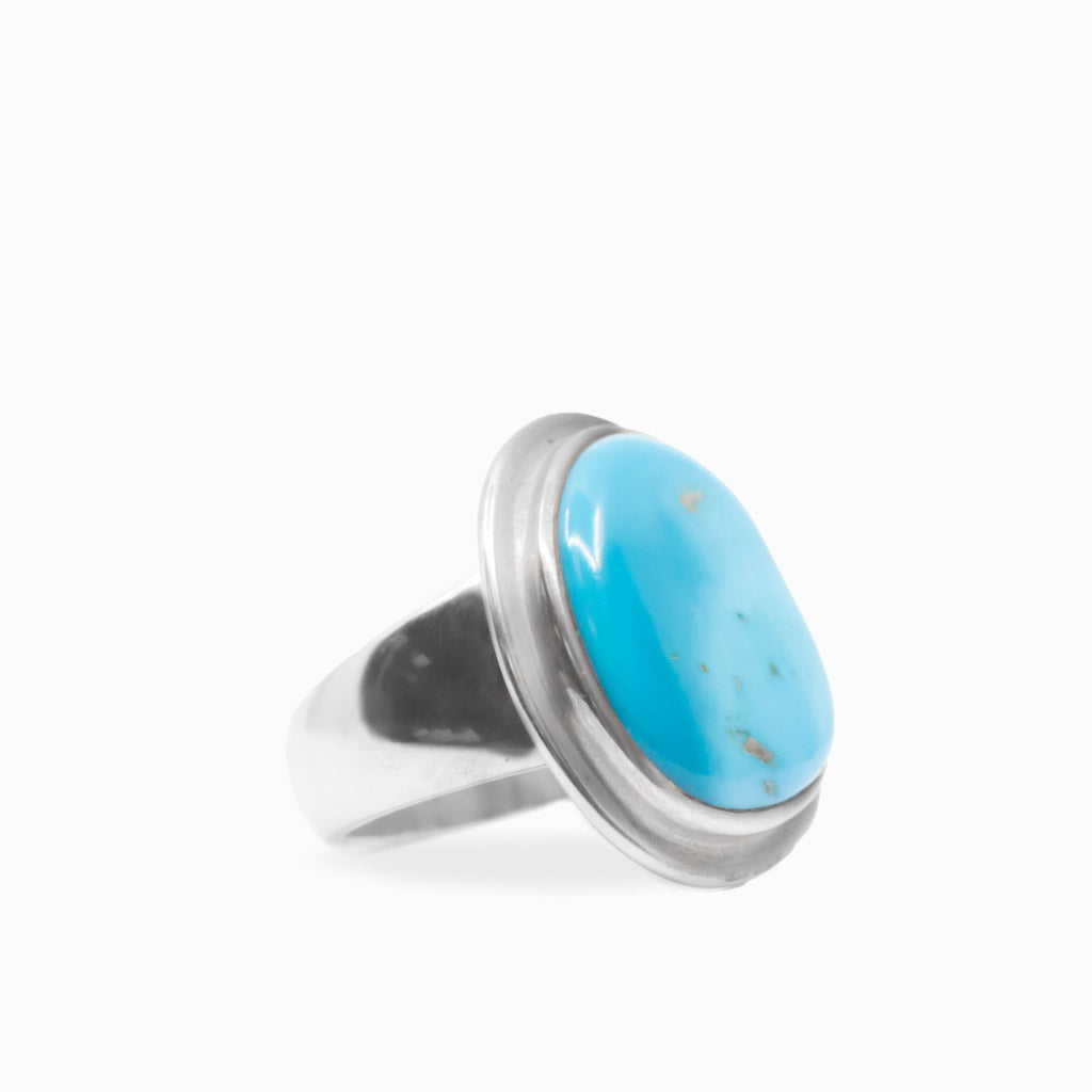 Bright blue Sleeping Beauty Turquoise cabochon ring set in a smooth polished 925 sterling silver bezel.