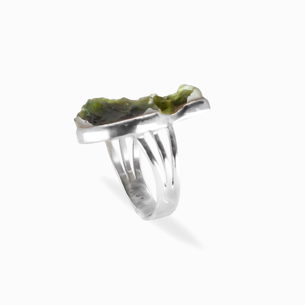 Raw freeform olive-green Moldavite ring with natural textured surface set in polished 925 sterling silver.
