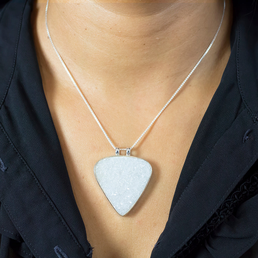 Model Wearing Reverse triangle white raw Clear Quartz Necklace made in earth