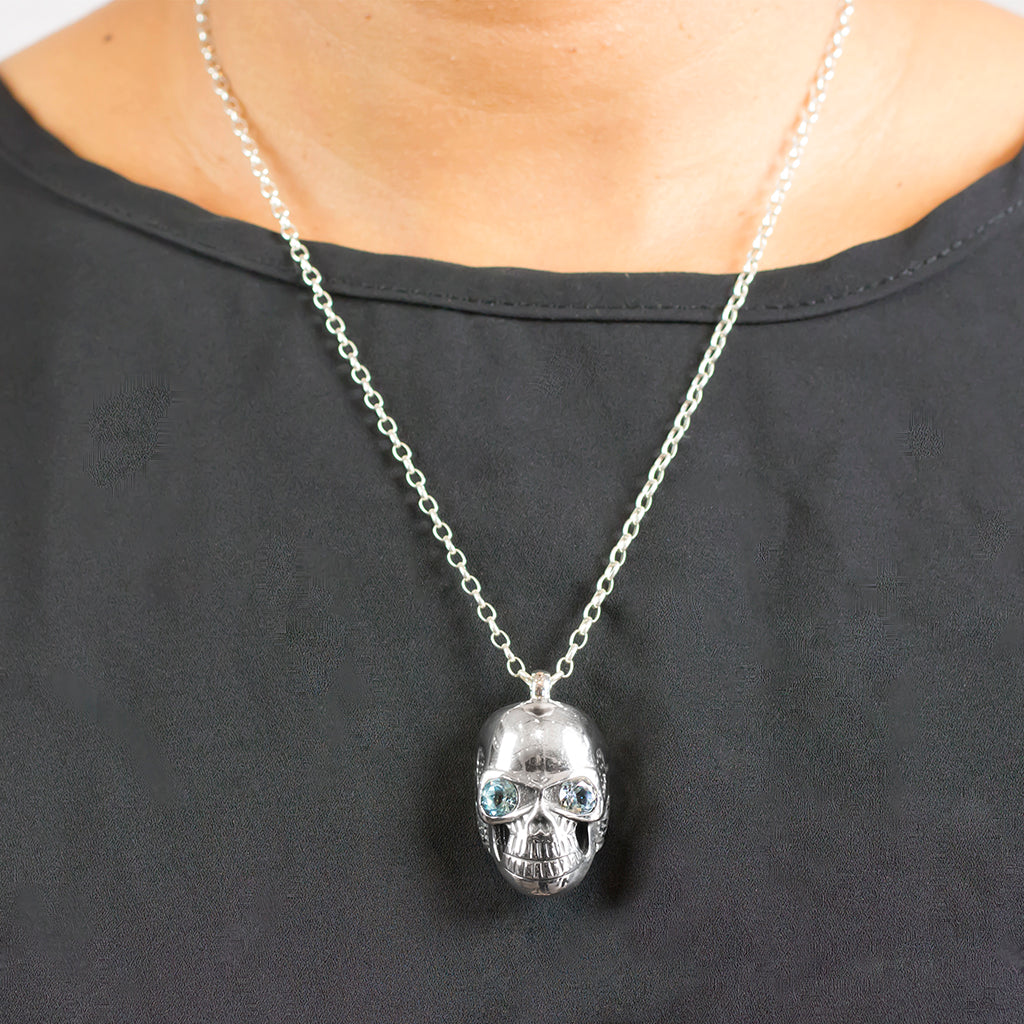 Silver Skull Necklace with light blue topaz crystals Blue Topaz Necklace made in earth On Model