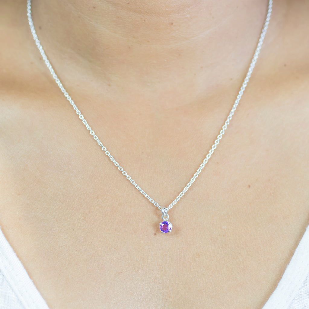 Faceted Purple Circular Amethyst Crystal Birthstone Made in Earth On Model