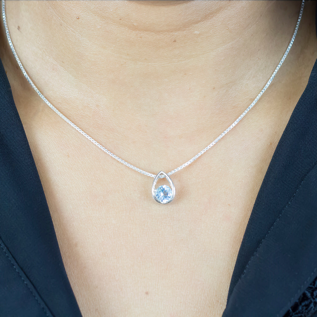 Faceted Round Blue Topaz necklace on model
