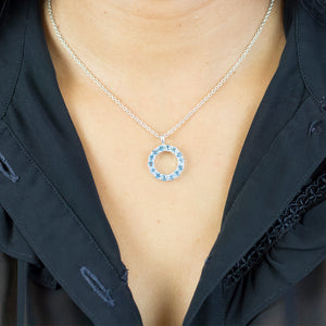 Model Wearing Blue Topaz Faceted Circle Necklace Made In Earth