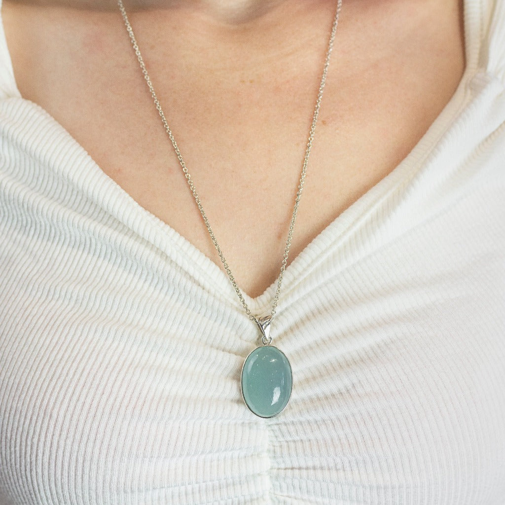 Model Wearing Light blue oval cabochon Aquamarine necklace