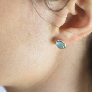 oval Aquamarine Cabochon Stud Earrings On Model Made In Earth