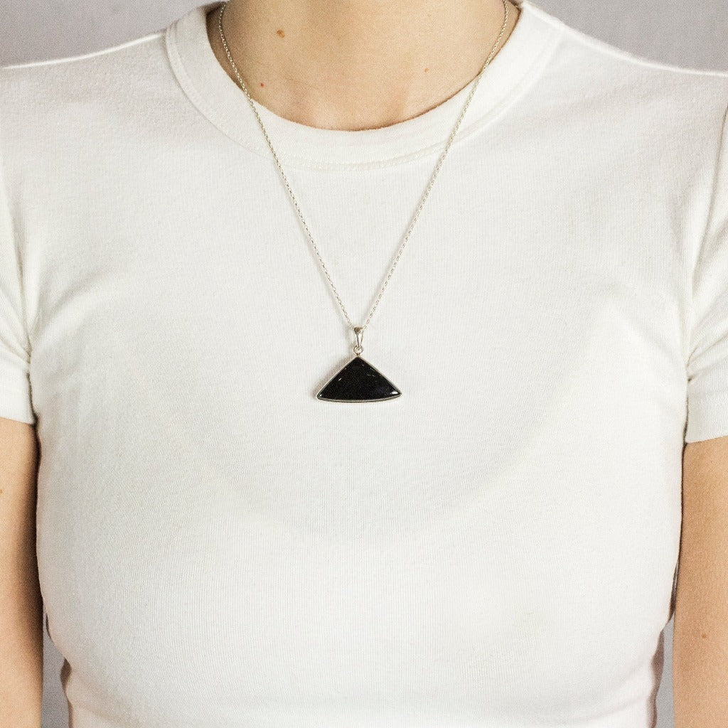 Black Tourmaline Cabochon Triangle Necklace In Sterling Silver On Model