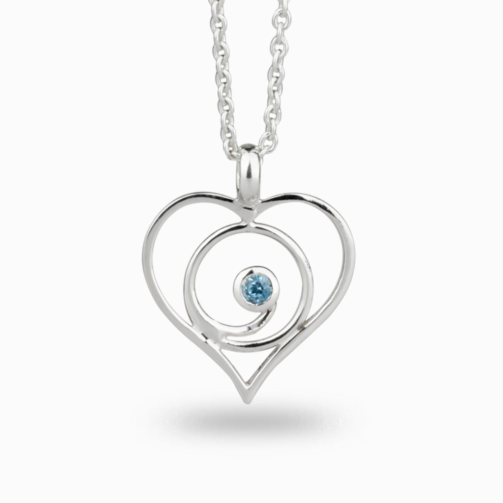 Light Blue Topaz necklace set in silver heart frame made in earth