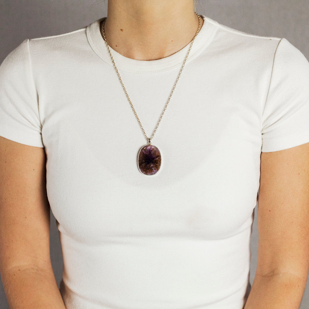 PURPLE BROWN CAB OVAL STERLING SILVER CACOXENITE NECKLACE ON MODEL