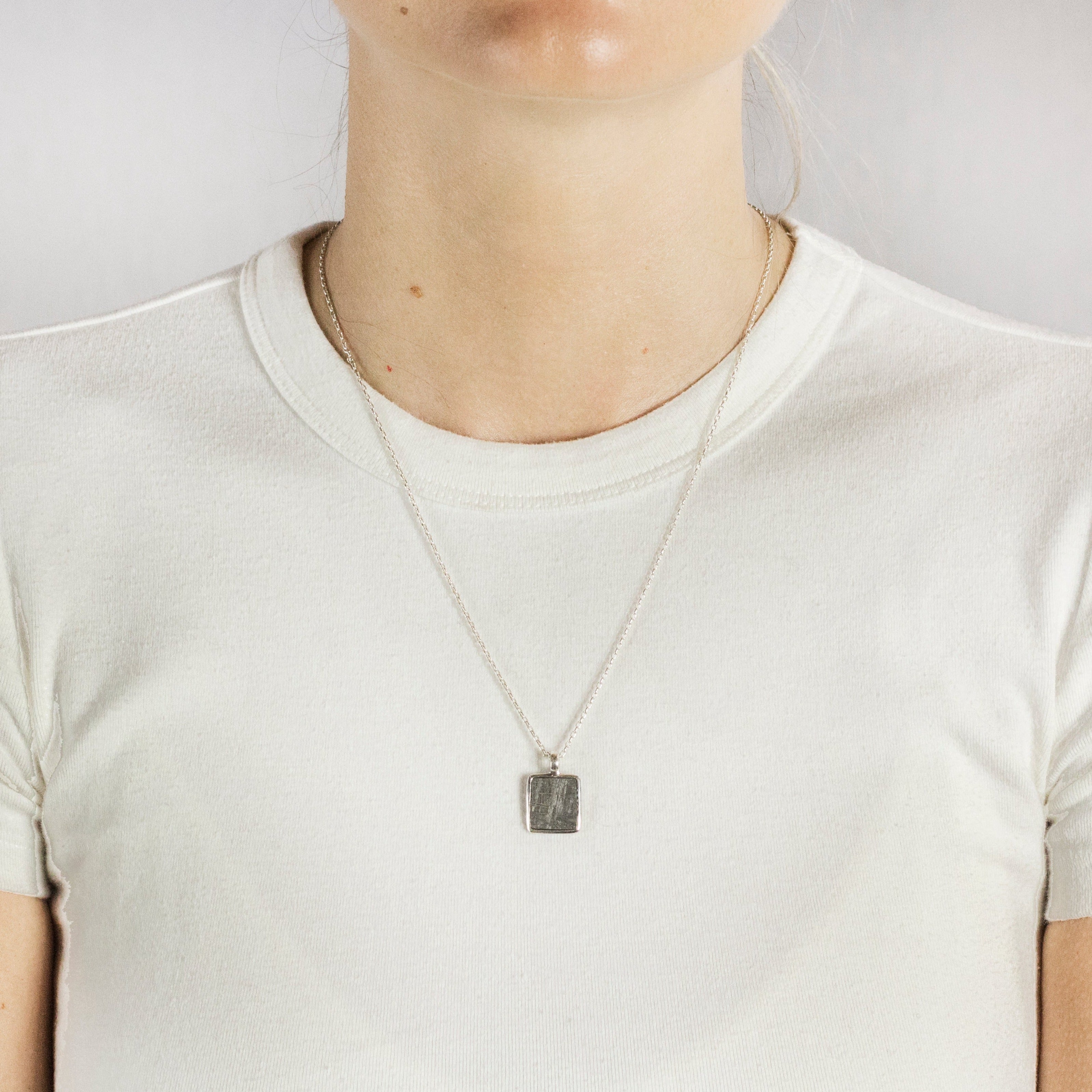 Model Wearing Grey Square textured Gibeon Meteorite Necklace