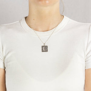Square Grey Textured Gibeon Meteorite Necklace On Model