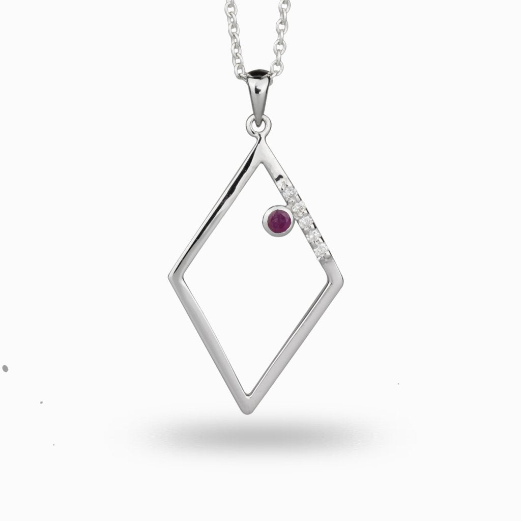 Violet ruby crystal framed by a rhombus accented with diamonds ruby and diamond necklace