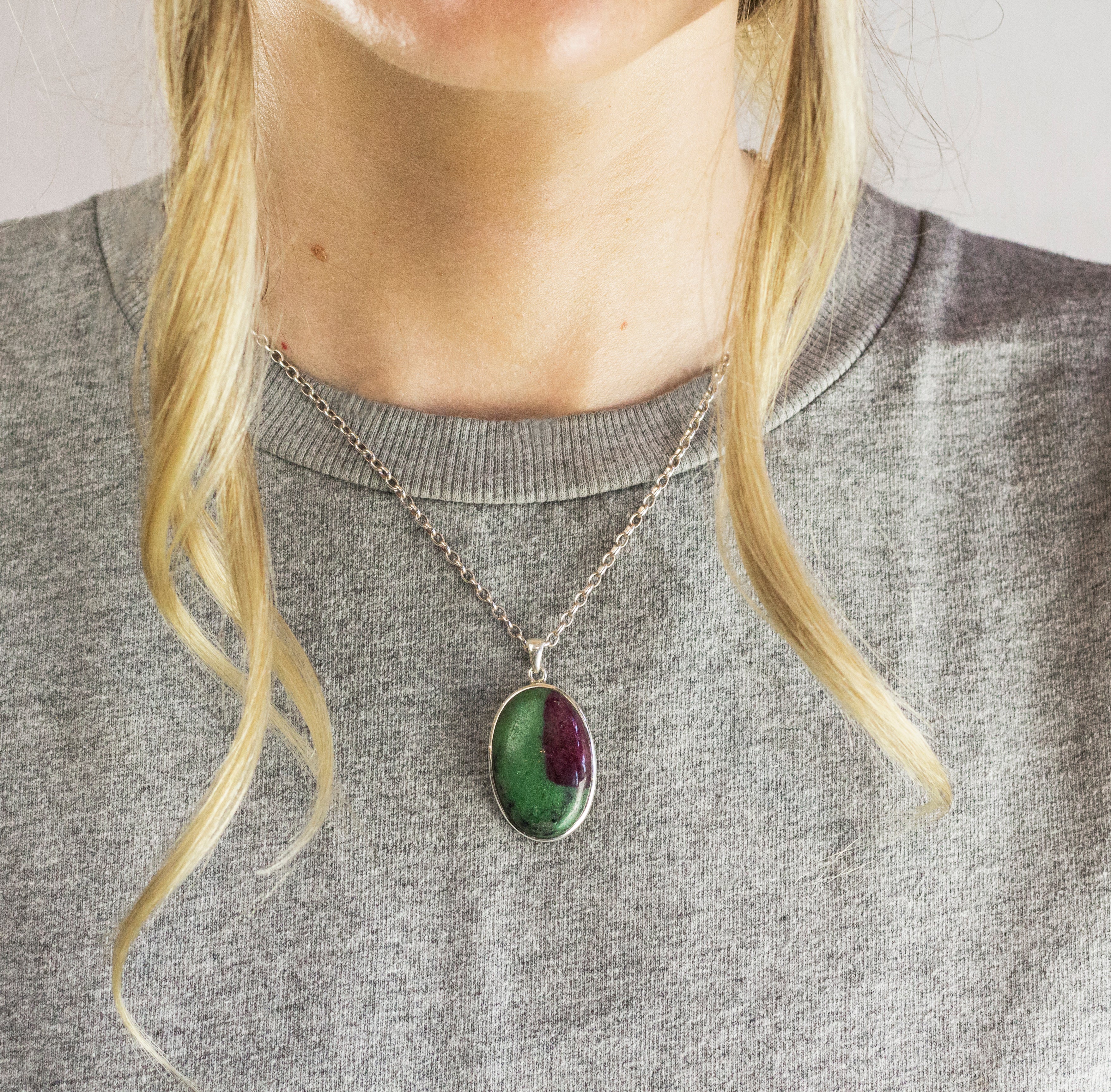 Model Wearing Cabochon Ruby Zoisite Necklace in Textured Silver