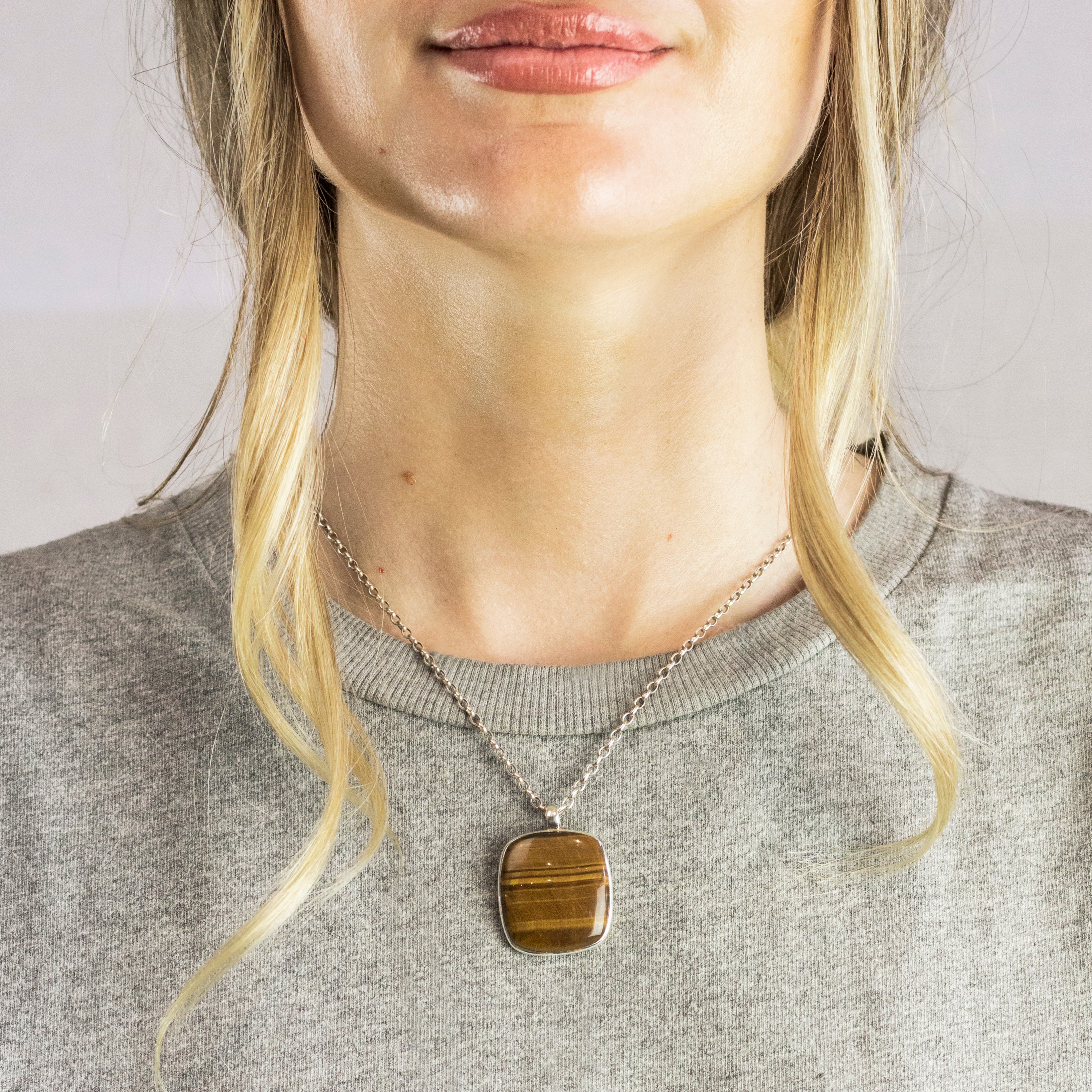 Model Wearing Rounded Rectangle Tiger Eye cabochon necklace