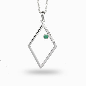 Emerald gemstone framed in a trapezoid accented with diamonds Emerald and Diamond Necklace made in earth