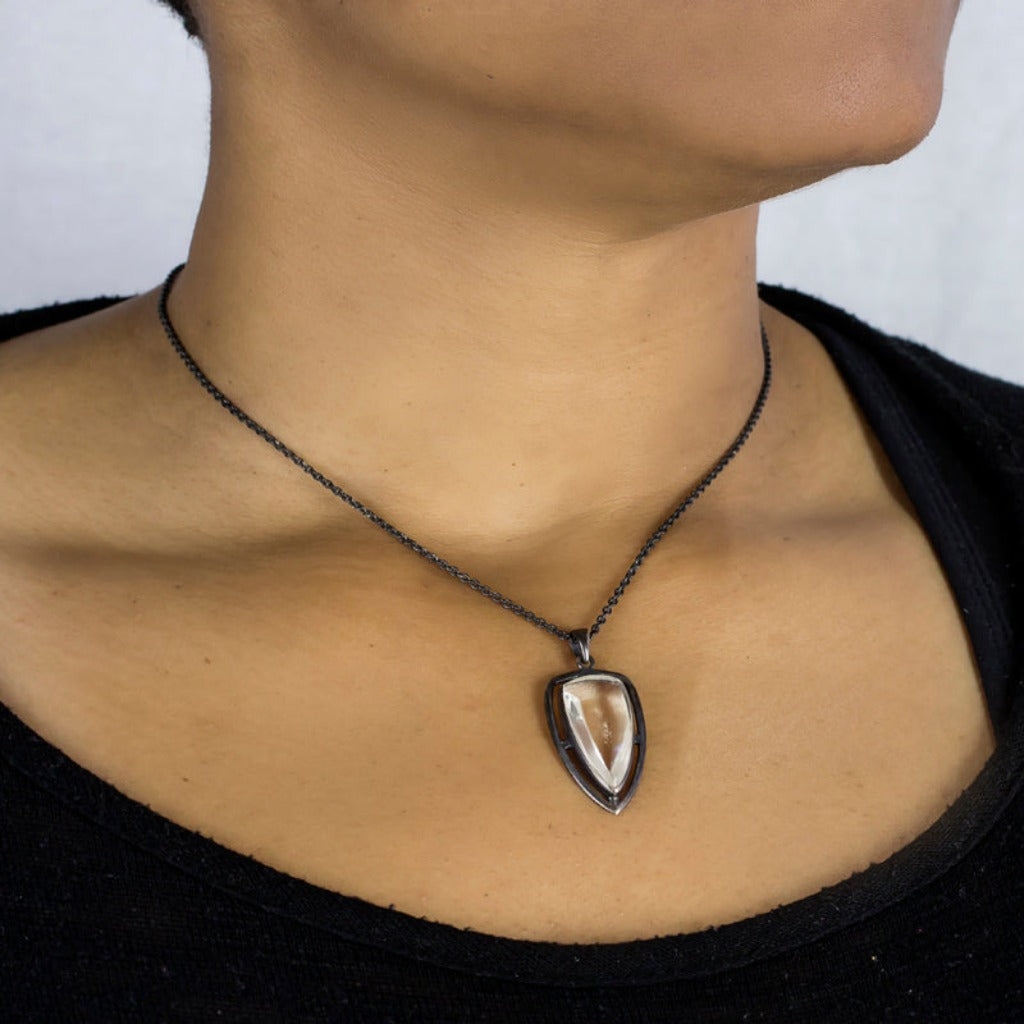 reverse rounded triangle in dark sterling silver frame Clear Quartz Necklace Made in Earth