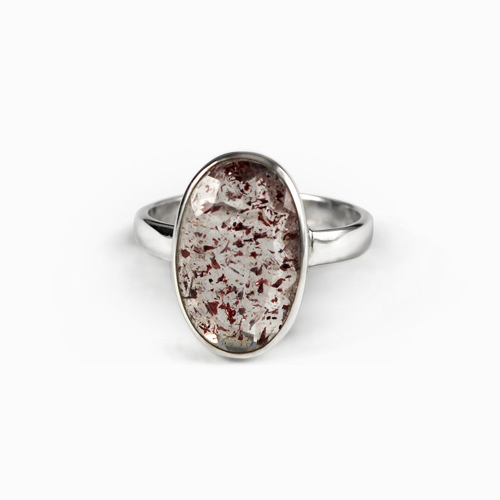 Lepidocrocite Ring a Clear faceted ring with dark red specks Made in Earth